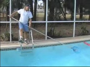 scooping debris from pool
