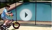 Boy Rides His Bike into Pool Fence